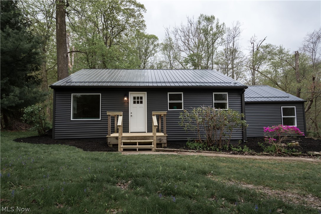 Welcome home to 9845 Chardon Rd, Chardon! This renovated 2-bedroom, 1-bathroom ranch is move-in ready, offering a cozy retreat with modern amenities. Step inside to discover a completely renovated interior with new everything, allowing you to simply sit back and enjoy.
Outside, the home boasts a striking exterior with dark siding and a new roof, complemented by upgraded windows and doors for added curb appeal and energy efficiency.
Inside, the heart of the home is a stylish shaker kitchen featuring moody granite countertops and all-new GE appliances, perfect for whipping up culinary delights. The spacious mudroom not only houses laundry facilities but also offers extra storage with a couple of closets, keeping your living space clutter-free.
For comfort year-round, the furnace has been updated with central air conditioning, ensuring your utmost comfort in every season.
The oversized back garage and concrete drive provide ample parking and storage space, while the backyard is a nature lover's paradise, with a ravine hosting local wildlife for your enjoyment. With minimal yard maintenance required, you can spend more time relaxing on the small rear deck, soaking in the serene surroundings.
Don't miss out on the opportunity to make this charming home yours. Schedule a viewing today before it's gone!