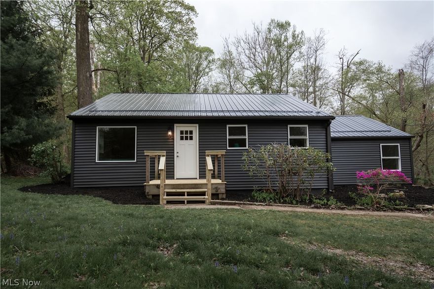 Welcome home to 9845 Chardon Rd, Chardon! This renovated 2-bedroom, 1-bathroom ranch is move-in ready, offering a cozy retreat with modern amenities. Step inside to discover a completely renovated interior with new everything, allowing you to simply sit back and enjoy.

Outside, the home boasts a striking exterior with dark siding and a new roof, complemented by upgraded windows and doors for added curb appeal and energy efficiency.

Inside, the heart of the home is a stylish shaker kitchen featuring moody granite countertops and all-new GE appliances, perfect for whipping up culinary delights. The spacious mudroom not only houses laundry facilities but also offers extra storage with a couple of closets, keeping your living space clutter-free.

For comfort year-round, the furnace has been updated with central air conditioning, ensuring your utmost comfort in every season.

The oversized back garage and concrete drive provide ample parking and storage space, while the backyard is a nature lover's paradise, with a ravine hosting local wildlife for your enjoyment. With minimal yard maintenance required, you can spend more time relaxing on the small rear deck, soaking in the serene surroundings.

Don't miss out on the opportunity to make this charming home yours. Schedule a viewing today before it's gone!