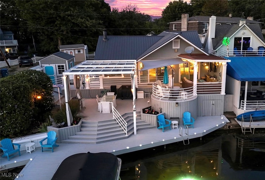 *GORGEOUS LAKEFRONT RANCH On West Reservoir, Part Of The Main Chain Of Portage Lakes! *ONE FLOOR Living W/Amazing Views Of The Lake! *RARE Parking For 7 Cars *58' Frontage + Boat Dock *What Sets This Home Apart From Others ~ TRIPLE TIER Grand Lakefront Entertaining Includes CUSTOM Covered Tv/Lounging Area Right Off Of The Master Suite + Circular Sitting Area + Grilling/Seating Table Area PLUS Deck Frontage For Chairs Directly By The Water! White Modern Railings, In Deck Solar Lighting ~ Making This An Upscale, Peaceful, Serene Setting To Sit Outside Daytime Or Evening In The Comfort & LUXURY Of Your Brand New Lakefront LOW MAINTENANCE Home!! *Upgrades Include: NEW METAL ROOF, NEW FURNACE '24, CARPET In Living Rm And Master Bedrm, ShadeFX Deck CANOPY Retractable @ A Push Of A Button & Custom Curtains, New 3 Panel SLIDING GLASS DOOR From The Living Room To The Deck, 2 Panel SLIDING GLASS DOOR From Bedroom To Deck, ON DEMAND WATER SOFTENER, Added CEMENT Drive, Custom 10’x 12’ SHED, Solar DOCK LIGHTS & DECK LIGHTS, Added A SWIMMING COVE, Extended ROOF For Covered Entertaining Area, Basement Floor + Ceiling *Columns In Front & Back, Covered Front Porch *Walk In To A Foyer W/Crown Molding *Ahead Is The Living Room W/Eat In Area, GAS FIREPLACE, CROWN Molding & Sliders To The Deck W/Stunning Waterfront Views *The Kitchen Showcases A Dimensional SKYLIGHT, Cabinets & Countertops On ALL Sides Including SS Refrigerator, GAS STOVE, Dishwasher & Microwave *Waterfront VIEW First Floor MASTER SUITE W/Custom Wall & Crown Molding Coverings, WALK IN CLOSET, Nice Huge Walk Up Attic For Storage + FULL Ensuite Master Bathrm ~Walks Out To The Covered Deck W/Ceiling Fan + Electric *The Basement Boasts A 2nd FULL Bathrm, Clean SEMI FINISHED Rm That Could Be Redone As A Rec Rm OR 2nd Bdrm, Laundry/Storage + Under Deck Storage For Kayaks, Canoes **Septic, Well, Radon PASSED/Complete *For Sale: Outdoor Furniture, 2019 Bennington 22SLX Pontoon, 2019 Yamaha F115LB Outboard Engine *LIVE VIDEO