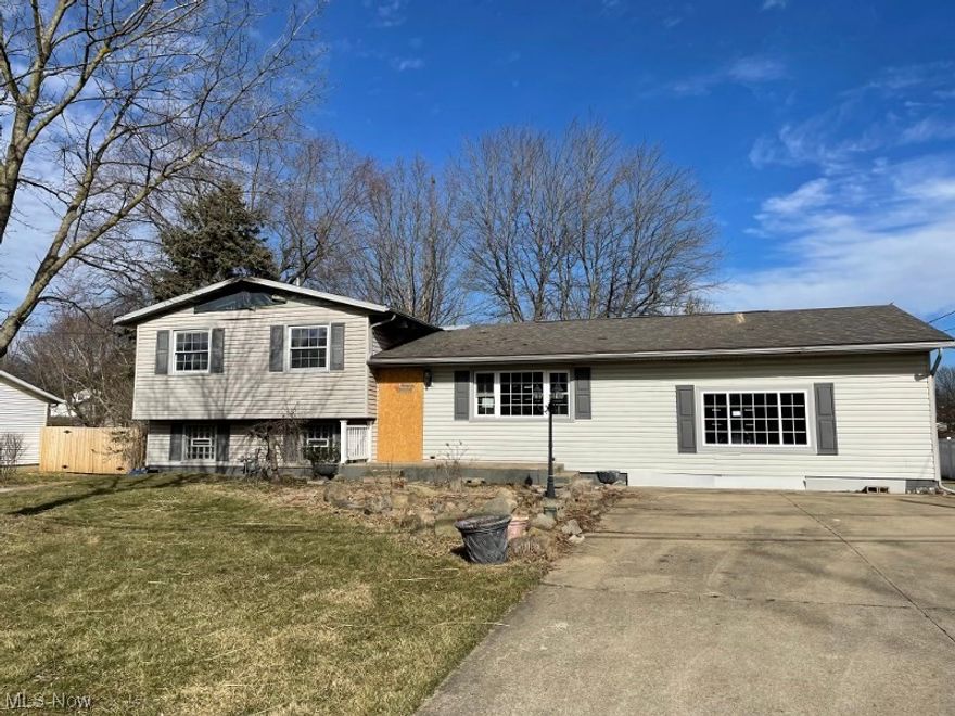 Split located in Revere Village .45 acre lot detached over size garage.