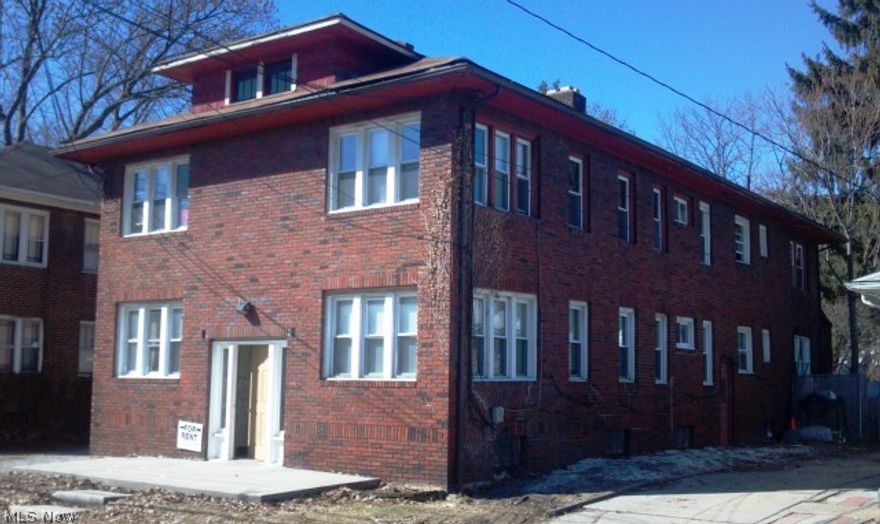 Investment opportunity near University of Akron. Four-unit brick building with 2-bedroom apartments. Tenants pay gas and electric.
