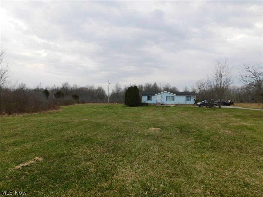 Three bedroom and two full bath home on five acres. The living room & dining room has beautiful laminate flooring. The spacious master bedroom has a walk in closet and full bath. The kitchen was updated in 2014 and has gorgeous backsplash and an island you can use as an eat in kitchen if desired. The backyard is wooded in the back of the property. The driveway has ample parking and turn around. There's a shed for outside storage. The front yard is secluded from the road & the driveway has apple trees beside it leading up to the home. Mineral rights transfer. Propane tank is leased