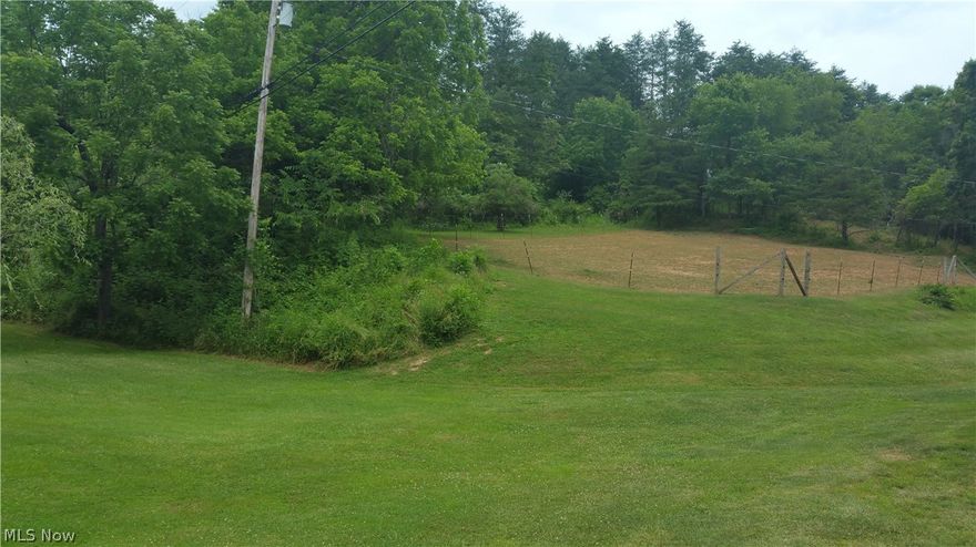 4.19 acres. Water is available. No tap on property. Electric pole is set but can be moved. Land starts 4ft from #4699 residence. Fenced in area is on property.