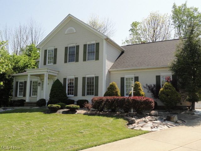 Situated in Village West of Hudson, this elegant traditional style Colonial is quality built w/custom features throughout. Two story foyer entry w/hardwood flrs that continue throughout the entire 1st flr. Impressive office w/built in cabinets w/rich wood molding and trim. The formal living rm & formal dining rm are spacious, open and bright. The huge kitchen has cherry cabinets, granite counters, breakfast bar plus a dinette, all open to the family rm w/skylights, fireplace and sliders to patio, backyard and gazebo w/hot tub! The double sided open staircase leads to a large loft area and 4 bdrms, 3 full baths. All countertops are gorgeous high end granite. Master suite w/cathedral ceiling, double walk-in closets & glamour bath offering a jetted tub, double vanity & separate shower. Lower level has a large rec rm w/possible 5th bedroom & a 4th full bath. Home sits high on a cul-de-sac lot and from Village West you can bicycle to downtown Hudson! Home warranty included too.