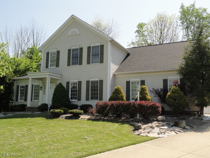 Situated in Village West of Hudson, this elegant traditional style Colonial is quality built w/custom features throughout.  Two story foyer entry w/hardwood flrs that continue throughout the entire 1st flr.  Impressive office w/built in cabinets w/rich wood molding and trim.  The formal living rm & formal dining rm are spacious, open and bright.  The huge kitchen has cherry cabinets, granite counters, breakfast bar plus a dinette, all open to the family rm w/skylights, fireplace and sliders to patio, backyard and gazebo w/hot tub! The double sided open staircase leads to a large loft area and 4 bdrms, 3 full baths.  All countertops are gorgeous high end granite.  Master suite w/cathedral ceiling, double walk-in closets & glamour bath offering a jetted tub, double vanity & separate shower.  Lower level has a large rec rm w/possible 5th bedroom & a 4th full bath.  Home sits high on a cul-de-sac lot and from Village West you can bicycle to downtown Hudson!  Home warranty included too.