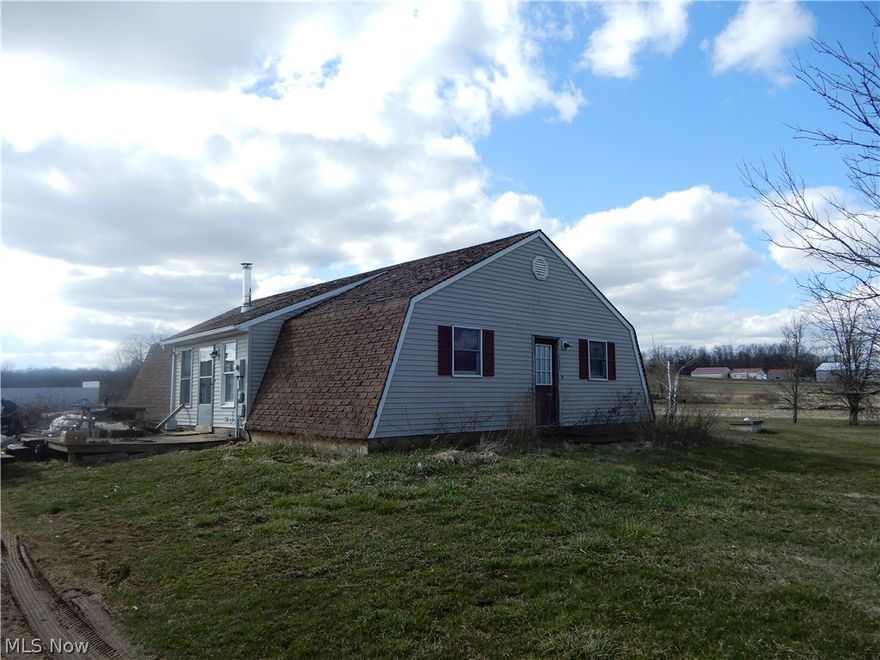 Universal Land Use of this 6.603 property is Field and Seed. The 3 bedroom, 1 bath is a Quoneset Hut built in 1997.  This is a Fannie Mae Homepath property.