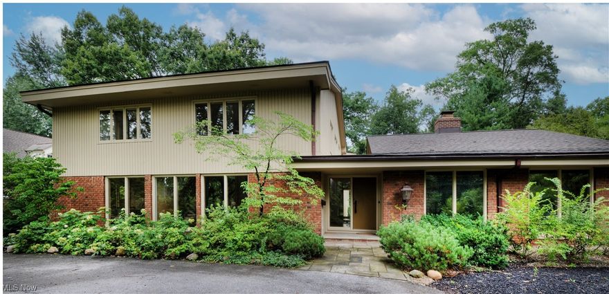 Custom built in 1966 by Bucchieri Construction, this one owner home epitomizes mid-century modern architecture. The gracious marble Entry Foyer acts as the hub for 1st floor access. The mirrored Living & Family Rooms each with floor to ceiling windows, hardwood floors & a common vaulted ceiling are sized for entertaining. The Office can accommodate all work needs with a panoramic window to view the Patio. Host formal dinners in the Dining Room or, for more casual occasions, the Morning Room + Kitchen is a chef's dream, with updated appliances, a pass-through window, and plenty of built-in storage space. A large laundry room adds convenience and practicality. There is a Full and a Half Bathroom on this floor. Moving up to the 2nd floor, the “super-sized” primary Bedroom has a full en-suite Bathroom, 2 walk-in Closets and a Dressing Area with a wall of built-ins. In addition, there are four bedrooms providing ample space for family or guests all with large closets; plus 2 Full Bathrooms. The Lower Level includes a large Rec Room, sump pump and HVAC systems which are zoned. Step outside to the fully fenced back yard, beautiful patio area, perfect for outdoor entertaining, and a pool that is deep enough to include a diving board. The house is generator ready. Don't miss the opportunity to own this remarkable masterpiece that combines architectural excellence, modern updates, spacious layout, beautiful finishes, & impressive amenities.