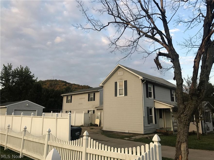 Side by side duplex. Separate utilities except water/sewer which the owner pays for and tenant pays for all other utilities. Property brings in $1,225/mo. Front unit has 3 bedrooms, 1.5 baths. The back unit is 2 bedrooms, 2.5 baths. All appliances stay. Approx half acre of fenced in yard. 1 car detached garage. 140x150 lot size. Back unit is rented for $600/mo with a 1 year lease. Front unit is rented for $625/mo with a 1 year lease. Owner handles lawn care. Superior Basement waterproofed basement in 2018.