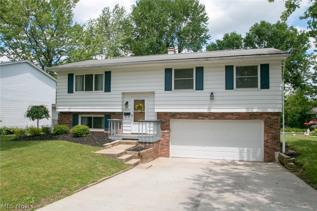 Fantastic updated bi-level in Stow! The home has many renovations, including: updated cabinets, back splash, counter tops, and stainless steel appliances in the kitchen. The breakfast bar/ island opens to the dining area and living room, updated with newer lighting. Off the dining area, you will enjoy the enclosed porch with access to the backyard. The main bathroom has been completely renovated with newer vanity, light fixture, cabinets and flooring. The lower level is perfect for additional living space, play area, or rec room, included in the lower level is an additional half bath and large storage and laundry area. Call today for your private showing.