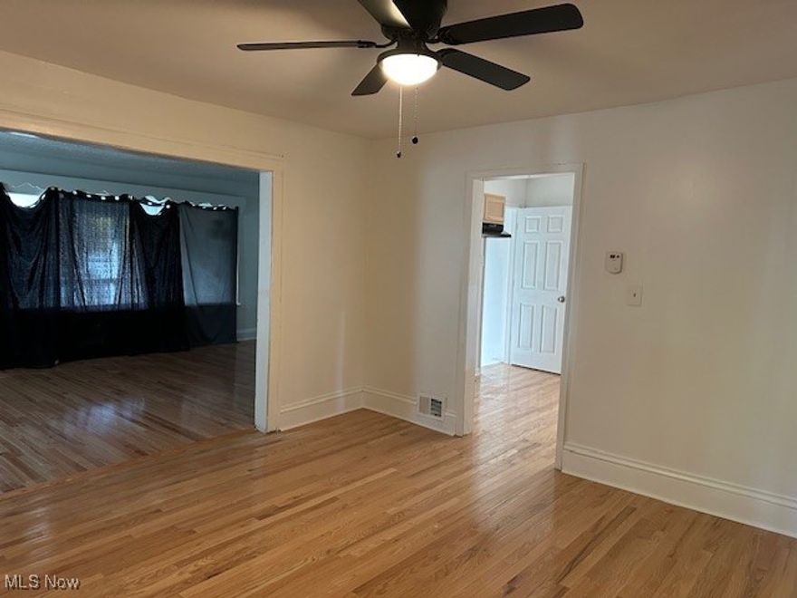 This practical, move-in-ready home is perfect for first-time buyers or investors. It features finished hardwood floors, offering durability and a warm touch. This property has Energy-efficient vinyl replacement windows and fresh paint throughout. The kitchen has been updated with newer cabinets, a sturdy countertop, a new sink, and faucet—all ready for daily use. Ceiling fans are installed in each main area, providing year-round comfort. The bathroom includes an updated vanity, finished basement with younger furnace and hot water tank. The property has a 2-car garage detached garage and a front porched idea for the morning cup of coffee or evening tea.