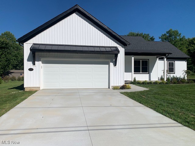Custom ranch design is available for immediate occupancy. Built by experienced construction manager with high standards and a lot of pride! Functional floor plan offering 1,730 square feet of living space. Covered, front porch. Great room with 13' vaulted ceiling, open concept. Split bedrooms with master suite on one side and secondary bedrooms on opposite side of the great room. With 36" exterior & interior doors, handicap accessible; note that pocket doors in master bath and master closet are 2' 8".
Quality quartz countertops in kitchen, large island, abundant cabinetry, under cabinet accent lighting and more. Sliding doors near dining area access the covered, rear porch. Nice pantry with sliding door, quartz counter tops, cabinetry, shelving and plenty of electrical outlets. Generous sized, secondary bedrooms with ample closet space. Covered porch in rear is 20 x 11' and the foundation enables potential to enclose and finish as additional square footage.
Efficient and spacious laundry room with man door to exterior. Closet in laundry room facilitates on demand hot water unit and scuttle access to crawl space. Crawl space is approximately 40" deep, has a cement floor and ample lighting - provides for valuable storage space. Drain tiles lead to a sump pump crock with a battery back-up system. The suspended, gas fueled, horizontal furnace is located in the center of the crawl space area.
Attached garage is wider and deeper than average with storage nook and window, automatic door opener and metal roof over front entry. Drop zone with bench where garage transitions into the home. Several nice touches and product selections ... list of standard features available upon request. Situated on an approximate, 92 x 269' lot ... plenty of play area and space for an out-building. Freshly poured, cement driveway and final grading completed.
A distant view of Lake Erie and in close proximity to some great lakefront parks in Madison Township!