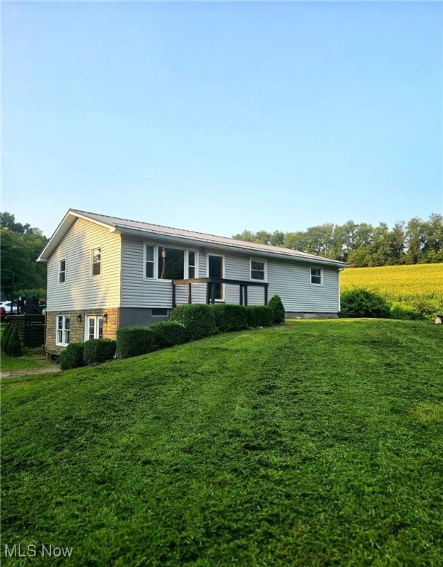Welcome to 928 Township Road 2704, a beautifully updated 3-bedroom, 2-bathroom home that combines rustic charm with modern amenities. This property features a spacious 3-car garage with a convenient workshop area, a cozy bar, and a versatile bonus room in the finished basement—perfect for entertaining or relaxation.
Enjoy the durability and low maintenance of a metal roof, along with a newly installed well and a convenient house vacuum system. New LVT and wood floors flow throughout the home. The home is  complemented by stunning coffered and shiplap ceilings that add a unique touch.