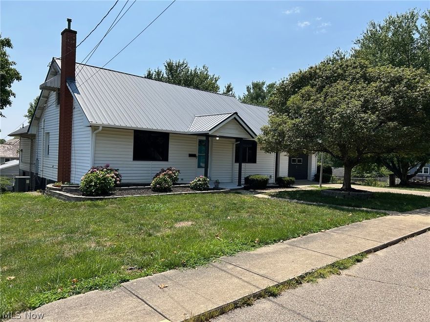 This property is definitely not a drive by! Amazing square feet offered in this home! First floor offers spacious living/dining room combo with wood floors and picture windows, cozy kitchen with entrance to breezeway and single car garage, just remodeled master suite offers a sitting area and laminate flooring, double closets with master bath offering a walk in shower with tile surround, double bowl quartz vanity and its own private laundry area, 2nd bedroom and additional full bath. Upper floor offers 2 bedrooms, a third remodeled full bath and 2 areas that would make great office or reading nook space. Lower level could easily be a in-law suite, rented as a separate apartment or even AirBnb - offers a spacious living room, eat-in kitchen, 4th full bath with laundry, bedroom, office, and mud room area with its own private entrance. This home sits on a triple lot with an amazing fenced in yard, two gazebos, additional garage with shed off alley entrance, fish pond, mature landscaping and so much more. Dual HVAC, on demand hot water, metal roof...there is a lot to love about this home!