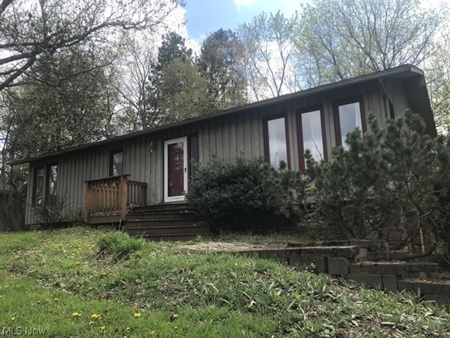 Come see this Cedar Ranch situated on a quiet street on over a half acre in Tallmadge! You will love the views from the deck of the property's expansive back yard. Come inside to a spacious living room with vaulted ceilings and great natural light. The kitchen is also very large with plenty of countertop and cabinet space for storage. The two upstairs bedrooms are good sized and enjoy lots of closet space..there is a half bath off one of the bedrooms! Downstairs adds another bedroom and another full bathroom! Property needs work and some repairs to restore to its original beauty but offers great potential for a great home and peaceful lot in Tallmadge. Just a mile off Tallmadge Circle and close to the area's best shopping and entertainment and Tallmadge Schools. Don't miss your chance - Make your appointment to tour this home today!