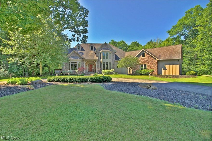 Breathtaking! This grand colonial is situated on a very private park-like lot. The grounds are phenomenal! Outdoor paradise with an expansive multi-tiered deck overlooking the fenced-in backyard and an in ground pool with poolside seating. Inside features an open layout with soaring ceilings and many windows bringing the outdoors in. Beautiful gourmet kitchen with granite counters, an abundance of cabinets, and stainless steel appliances. Off the kitchen is a cozy hearth room with fireplace. First floor master wing with an office, private deck, his and her walk-in closets, and a luxurious bathroom featuring a steam shower and jetted tub. The first floor also includes a great room, dining room, mudroom with custom built cubbies, a laundry room, powder room, and a full bathroom. The second floor features a very large playroom/bonus room, 3 bedrooms, and 2 jack’n’ jill bathrooms. Upgrades: central vac, Kinetico water treatment system, security system, dual staircases, two HVACs--one brand