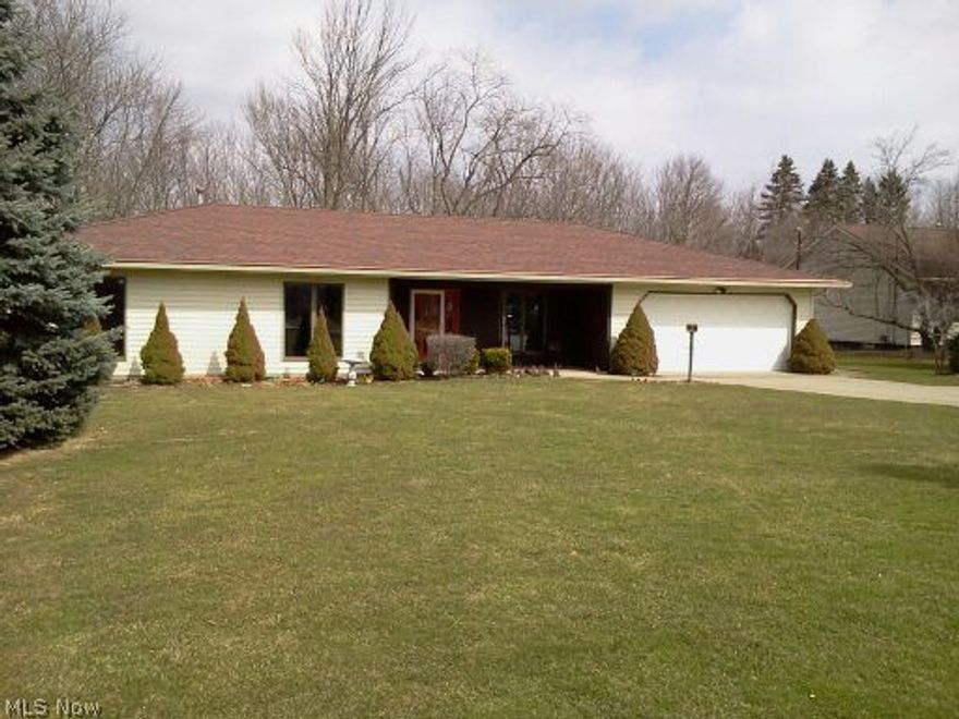 Newly painted, new flooring, open layout, 3 bdrm ranch, one floor living and sits comfortably on a 1 acre wooded lot.  Walking up to the large front porch you can picture yourself in the morning with a cup of coffee and organizing your day.  The front entry opens to the great room with a fireplace that has been newly updated with slate tiles and a large mantle to display your family or travel photos.  The formal dining room has 2 large windows that allow for additional natural light.  The home has 3 spacious bedrooms and 2 full baths!  The master bath has a walk-in, wheelchair accessible shower with easy-to-grip handles providing sturdy support.  

New stainless steel kitchen appliance package (yes, they all stay) and new light fixtures throughout. The 2-car, heated, garage has been painted and has additional storage cabinets, work bench and large sink area. This home will be great for entertaining, because the eat-in kitchen has a sliding glass door that leads to a maintenance free,