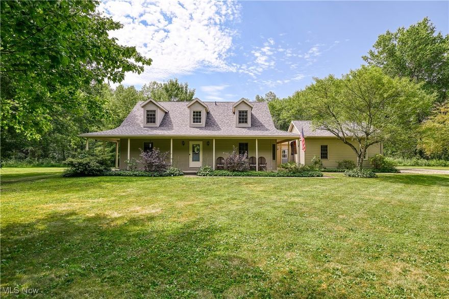 Welcome to this picturesque retreat featuring your very own stocked pond on 5 partially wooded acres. This home features a large great room with vaulted ceiling, first floor owner's suite, updated eat-in kitchen with granite counters and formal dining room on the first floor. Upstairs you'll find 2 additional bedrooms and a full bath.  Looking for a separate attached additional living suite? Walk through the laundry room and find a second full kitchen, living area, bedroom and full bath.  Enjoy your morning coffee on your wrap around front porch or back patio enjoying the view of the pond.  Large 3 car garage and additional parking space rounds out the exterior features. Don't miss out on your private retreat!