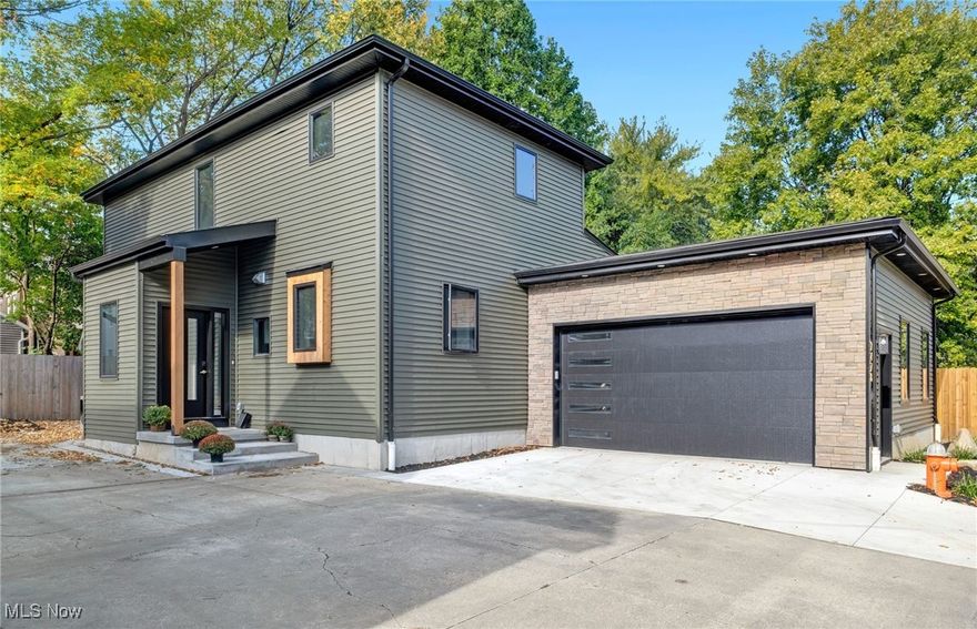 Welcome to luxury Tremont living in this NEW Construction custom-built home with a 15-year tax abatement application in process! Built under the Cleveland Green Home Initiative, this residence offers over 3,000 sq. ft., a strong HERS rating, and premium details including 9-ft ceilings, 2x6 construction, and Anderson windows. The open-concept first floor features a gourmet kitchen with quartz countertops, large island, tall soft-close cabinets, and SS appliances, flowing into the dining area and family room with fireplace and entertaining station. The first-floor owner’s suite includes a California walk-in closet, soaking tub, and Tyvarian marble shower, plus a laundry room and powder room complete the first floor. Upstairs find two bedrooms, an 18x12 loft, and a space for your stackable washer/dryer. The finished lower level adds a 17x38 rec room, full bath, and 16x17 flex space. Embrace energy-efficient living and lower utility bills with your high-efficiency compact AC, high-efficiency furnace, and tankless water heater. Enjoy a private covered patio and oversized EV-ready 2.5-car garage. Ideally located in a highly walkable neighborhood with easy highway access, this home puts you steps from Tremont’s vibrant dining scene, unique shopping, and the scenic Towpath Trail—offering the very best of city living. Hurry and schedule your showing today and make this exceptional NEW residence your home!