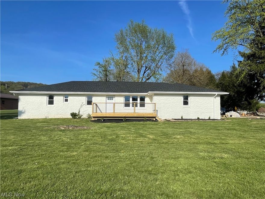 Once you step inside you won't want to leave. Located across from Hammond Park, this completely remodeled, 3 bedroom 2 bath, brick ranch rests on just under a half acre. Step inside the front door to an open floor plan that features a stone accent wall and a sliding barn door that leads into a large laundry room with a sink and new stack-able washer and dryer. Brand new Refrigerator, Dishwasher, Stove and Microwave for the kitchen. All bedrooms have new carpet, bathrooms have new tile and laminate flooring throughout the rest of the home. Bathrooms are all new, lighting and outlets also. A freshly painted exterior, to go along with a new 30 year architectural shingled roof, soffit, fascia and gutters. New windows, interior and exterior doors, as well as newly constructed decks waiting to be stained the color you desire. New forced air furnace with heat pump and new central air unit. You don't want to miss out on this one.