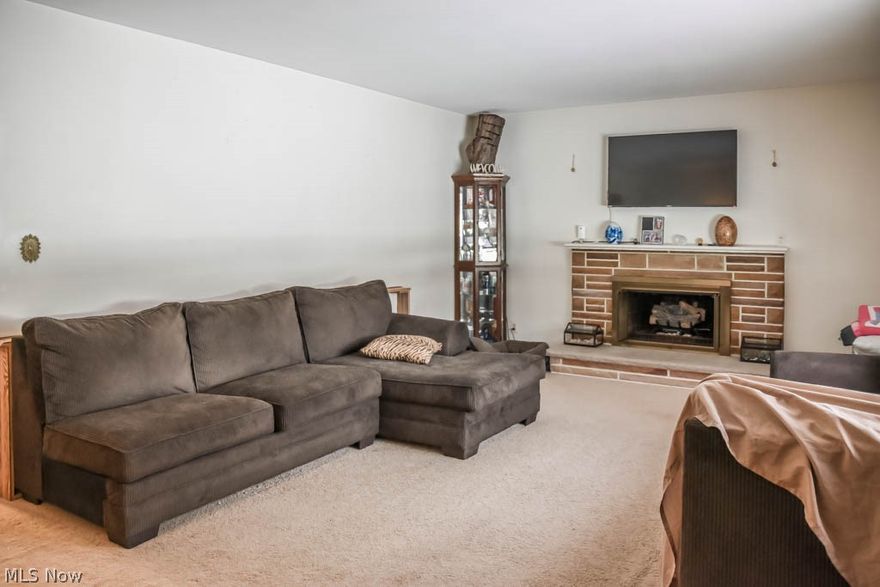 Much bigger than it looks! Charming 3 bedroom, 2 full bath brick home with a fenced backyard! Long, wide driveway leads up to your heated 2-car attached garage. Inside, you'll enjoy a picture window and a ventless fireplace in the living room. Crack open your cookbook in the fully applianced kitchen with a pantry, tile flooring and dinette! Off of the kitchen, there's a finished breezeway that connects to the garage and offers plank ceilings, many windows and patio access. Down the hall, there are 2 bedrooms, a hall linen closet and a full bath with tile shower surround. Upstairs, there's a huge master bedrooms with hardwood flooring, a walk-in cedar closet, a wide hallway with space for dressers and a dormer nook - great office or reading area! Extra living space on the lower level with 3 finished areas, glazed tile walls, a full bath and storage space. Wonderful outdoor area with a fully fenced backyard, a small pond, patio and a storage shed! Schedule a private showing today!