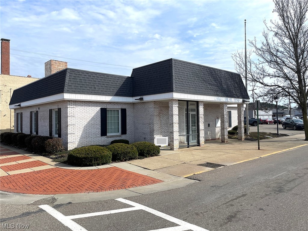 Hard Corner Retail Office Building, well maintained and ready to use. Previously used for bank, having walk-in safe, two half baths, nice open floor plan, and three private offices. Covered overhead drive-thru window, covered front entrance, and asphalt parking lot with 22 parking spaces. Terrific location across from the US Post Office and one block from the main road in Downtown Minerva, and easy access to US Rt. 30.