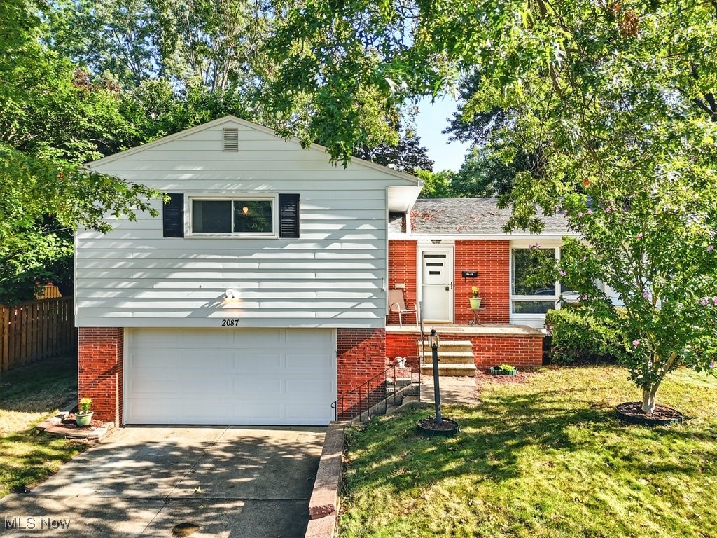 Just under half a mile from the prestigious Fairlawn Country Club, 2087 Brookshire welcomes you with the shade of mature trees and inviting curb appeal. This spacious split-level home offers a thoughtful layout and updates throughout. From the attached 2-car garage, step into a generous bonus room with brand-new carpet, just a few steps away from the main level. Here you’ll find the sunny family room with a cozy fireplace, built-in bookshelves, and hardwood floors, alongside the formal dining area and bright kitchen. A beautiful sunroom extends from the dining space—perfect for relaxing before enjoying the hot tub just outside.Upstairs, two bedrooms share a full bath, while the primary suite offers its own private bath and walk-in closet. The finished basement features a pool table (yours to keep) and an updated half bath—ideal for game nights or a second hangout area. With flexible space throughout, this home can easily adapt to your needs, whether for extra bedrooms, home offices, or creative spaces. Recent updates include: New A/C and gas dryer, New roof & gutters (2018), hot water tank & garage door (2024), dishwasher (2025), and hot tub (2017). Updates you’ll love: New roof & gutters (2018), hot water tank & garage door (2024), dishwasher (2025), hot tub (2017). Outdoor lovers will appreciate having Sand Run Parkway just around the corner and quick access to the Cuyahoga Valley National Park trail system.