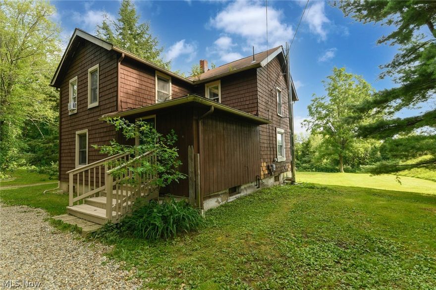 Spacious colonial located on Ravenna/ Diagonal Road in Kent. This approx. 1,872 square foot residence is looking for it's next owner! Nice backyard with woods in the parcel behind the house. Good double access driveway. 2- car garage.  This home has incredible space! 
New floors installed in 2020 run throughout most of the first level. The kitchen is open and nicely organized with a dining area. Open from the kitchen is the family room, the large family room is perfectly appointed for entertaining. 
The master suite enjoys two separate closets, and 2 additional bedrooms are serviced by a large hall bath, finishing out the second level. 
The basement has outdoor access, with a full bath. Well & Septic on the property, septic was maintenance 6 months ago.  This is to be sold AS IS. Cash/Conventional sale