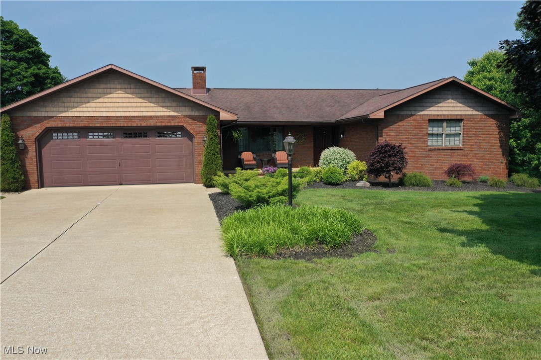 Welcome to this superb sprawling ranch. This one-owner brick beauty has been pampered like royalty. Nestled on 5 acres of Western Holmes County’s finest, a concrete driveway—leads you to this dreamy abode. Boasting 4 bedrooms, 3.5 bathrooms, and a grand total of 3,754 square feet (with 3,042 of those being prime living space), it’s your personal paradise. Sidewalk wines through the well-manicured gardens that lead you to your dream home. Inside, stunning hardwood floors sweep across an open concept living area, complete with a cozy family room, elegant dining space, and a chef’s delight of a kitchen. With oodles of cupboards and counter space, a butcher block island, and a coffee nook, this kitchen is a culinary playground. All kitchen appliances are staying for new owners. The first updated full bathroom features tile floors, a grand vanity, and cabinets galore. The owner’s retreat dazzles with dual closets, a linen closet, a spacious vanity, and a posh full bathroom with a walk-in tile shower that screams luxury. Two more bedrooms offer roomy closets. The living room, with its wood burner, has sliding patio doors that open to a private deck where sunshine and shade dance. Bonus: the hot tub stays, ready for post-unpacking relaxation! Full Basement that was just remolded (ALL of the floors are LVF). Rec room (pool table will stay), 2nd family room with Gas Erb Fireplace and New (only used twice) kitchenette with eye catching counter tops and brick wall that offers a little extra. Large 4th bedroom with huge walk-in closet. Updated half bath and large utility room (fridge will stay) completes the lower level. New water well installed Spring of 2025 along with new water system. Charming bridge offers easy access to the remainder of the property. Welcome Home!