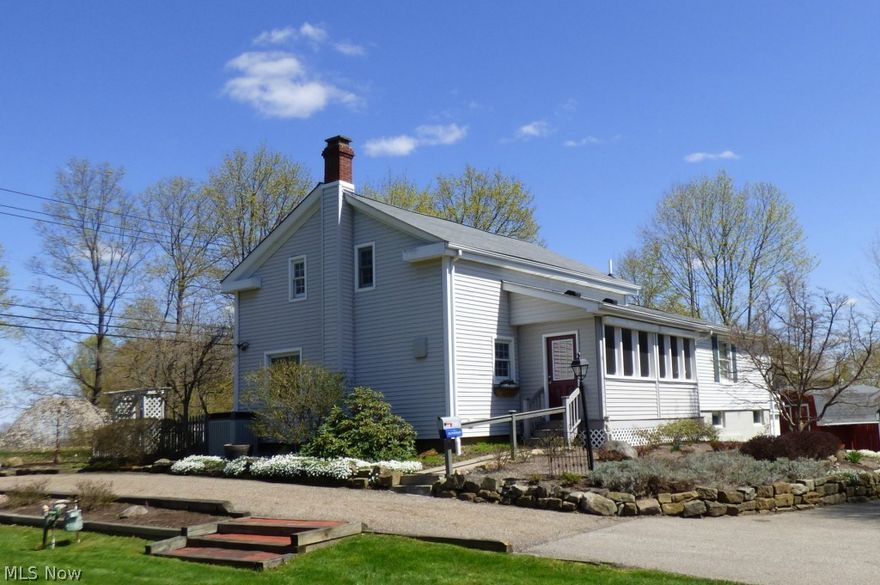 Historic Burton Village landmark home located at the point of S Cheshire and Huff St.  Wonderfully maintained inside and out, this 4 Bedroom, 2 Bath century home shows pride of ownership throughout.  Open Kitchen/Dining Room with wide plank floors and wood ceiling will be the center of many gatherings.  Formal Living Room with wide plank floor and ornate fireplace is off the main entrance.  Off the Living Room is the Master Bedroom and Bedroom 2 that also has a private Sitting Room overlooking the side yard.  Up the classic century home stair to the 2nd floor is Bedroom 3, loft Bedroom 4 and a full Bathroom & ample storage space.  Step down from the Living Room hall to the large Family Room with a pub style dry bar.  Continue through this room to the large Screened Porch that overlooks the beautifully landscaped yard.  There is a second Screened Porch off the Kitchen.  Both Screened Porches feature rolling storm shutter which keep these rooms dry and safe during bad weather and through