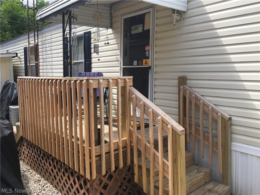 Affordable living in Stow!! You won't find anything that compares for the price! As you pull up you will see the quality and care that has gone into this home.
Siding and windows have been perfectly maintained, concrete parking pad is solid, roof is approximately 8 years old, water heater just 3 or 4 years old and A/C is brand new! Garbage disposal is new, furnace has been serviced and some internal parts replaced. The solidly built deck was just added last year. Patio, pavers and gravel are also new! The shed was build about 8 years ago. This Astro 1997 model offers a great floor plan. Now come on in to check out the space! Large eat-in kitchen offers lots of space, nice cabinets and laminate counter tops. The living room is spacious enough for numerous furniture layouts. There is a nice sized full bathroom, two bedrooms and a laundry area down the hall. The back door has a newly added screen door too. It's not just a mobile home it's HOME! Call to check it out today!