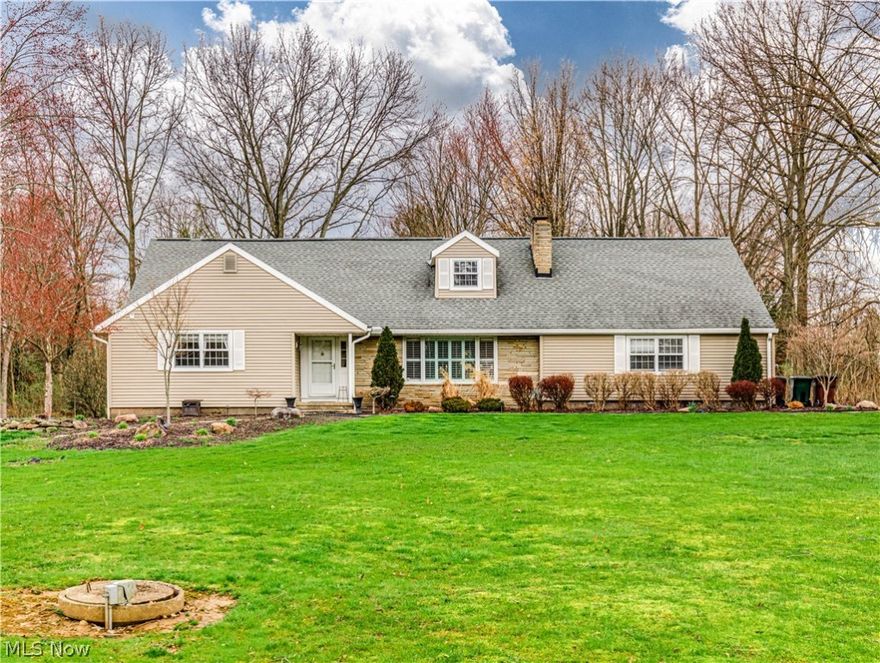 Welcome to this charming 4-bedroom, 2-bath Cape Cod-style home located in beautiful Bath Township within the highly rated Revere LSD. Situated at the end of a quiet dead-end road, this home offers peace and privacy on a generous 2.44-acre lot with a pond on the side yard that is shared with the neighbor. As you enter, you'll be greeted by the beautiful hardwood floors that flow throughout. The spacious living room is the heart of the home, featuring a cozy fireplace and a bay window that offers serene views of the front yard. The large eat-in kitchen has been tastefully updated with new cabinets, granite countertops, and new stainless steel appliances, creating a perfect blend of style and functionality. The main level of the home offers two bedrooms with a shared full bathroom, while the upper level hosts two additional nicely sized bedrooms and another shared full bathroom. The basement adds versatility to the home, featuring a partially finished area with carpeting, perfect for a recreation room or home office. The unfinished side of the basement serves as a workshop and laundry/utility room, complete with built-in cabinets and a workbench for your projects and storage needs. Enjoy outdoor living with ease through the screened-in porch/patio, conveniently accessible from both the 2-car garage and the main house. The expansive backyard is a true retreat, boasting a patio for outdoor gatherings and a storage shed for your gardening tools and outdoor gear. Don't miss the opportunity to make this your forever home, schedule your tour today!