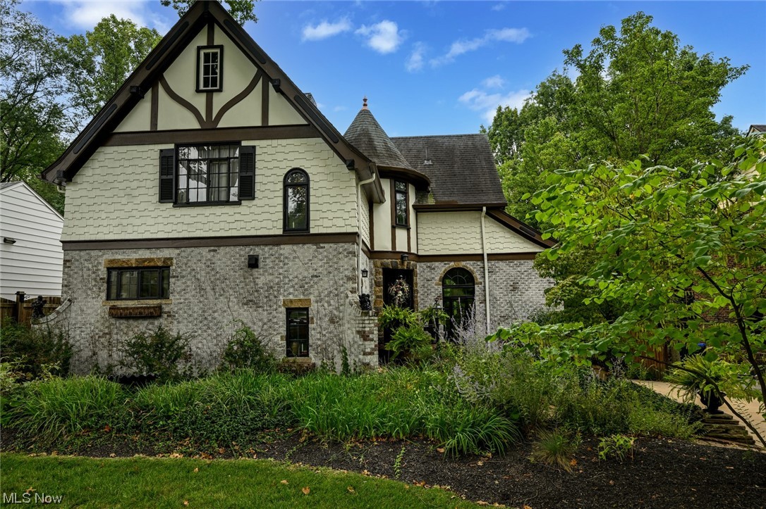 Here is the one home you've been eagerly anticipating buying ! This English Tudor Cottage is more than just a house; it's an experience waiting for you to call it home, where the ambiance, charming details, and beautiful surroundings come together to create a truly exceptional living environment. Entertaining here isn't just pleasurable; it's a pure joy. The heart of this home boasts a center gathering gourmet kitchen, perfect for culinary endeavors, while the spacious dining and living rooms with the fireplace radiate character and warmth, setting the stage for memorable gatherings. Buy this home and step outside to an inviting patio, deck, and a full in-ground pool, creating your private oasis surrounded by the beautiful natural surroundings, enhancing the overall ambiance. Built in 1931, this 3 bedroom brick and stone home is a one-of-a-kind, adding to its and character and craftsmanship . Every corner of this property tells a story, which further contributes to its unique charm. When you own this extraordinary property, its character-rich architecture sets you apart from the traditional, offering a truly fabulous and enchanting living experience.