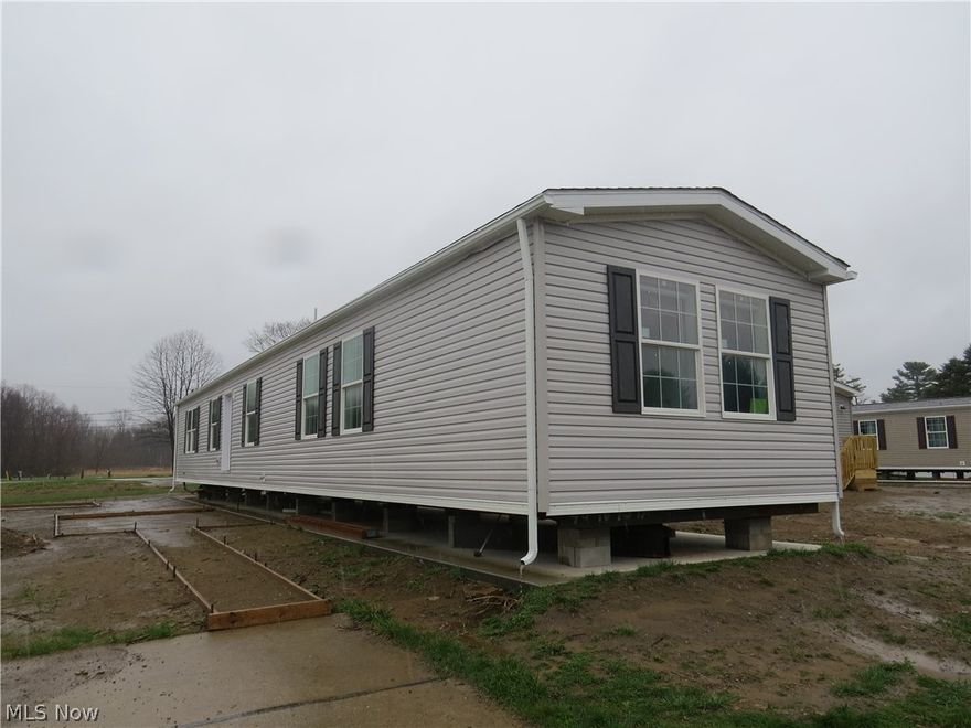 Brand new manufactured home offering 3 bedrooms, 2 full bathrooms, and 1,140 sq ft of living space. This home features a spacious living room, eat-in kitchen, and separate den, all finished with durable LVT flooring throughout. The primary bedroom includes a ceiling fan, walk-in closet, and private bath with walk-in shower. The kitchen is equipped with a stainless steel appliance package including electric range, refrigerator, microwave, and dishwasher. Drape package and 2” mini blinds included throughout for added comfort and convenience.