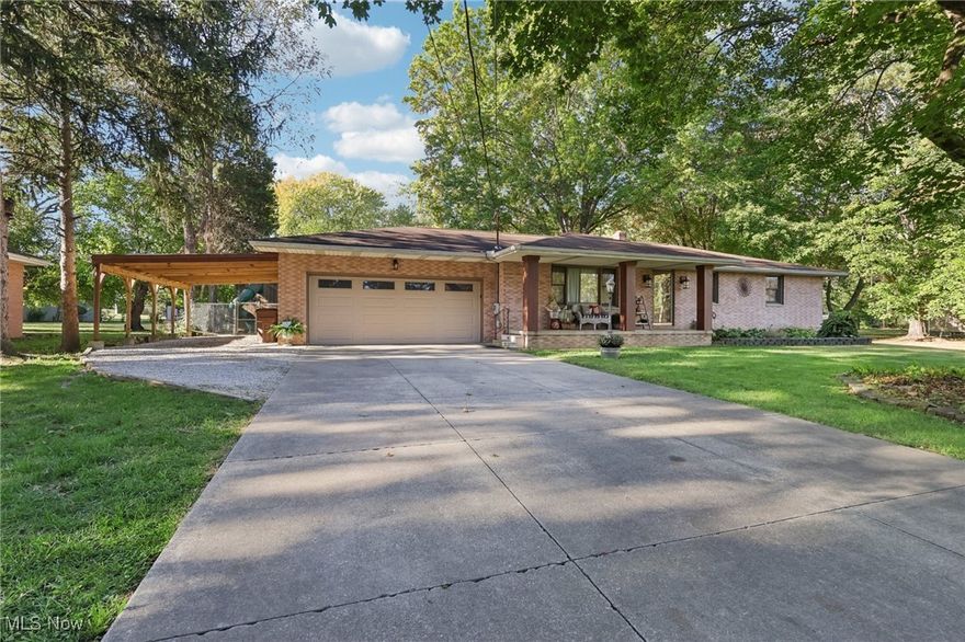 Discover your perfect ranch home, a spacious abode nestled on a generous lot just waiting for you. The interior has been fully repainted in the last four years and features new furnace and A/C units. As you approach, you'll be welcomed by established landscaping, a two-car garage, and an additional two-car carport. The large front window fills the living room with natural light, creating a seamless connection to the kitchen and dining areas. The kitchen offers ample cabinet space, accented by beautiful stone tilework, and is equipped with stainless steel appliances and a breakfast bar. The first floor includes three spacious bedrooms along with two half baths. Through the sliding glass doors off the dining area you’ll find a deck perfect for entertaining guests. Venture downstairs to the finished basement, where you'll discover a fourth bedroom, a full bathroom, a large recreation area, a lower-level bar, and plenty of storage options. This home truly caters to anyone's needs. Don't forget to enjoy the expansive backyard, which offers ample space for all your outdoor activities!