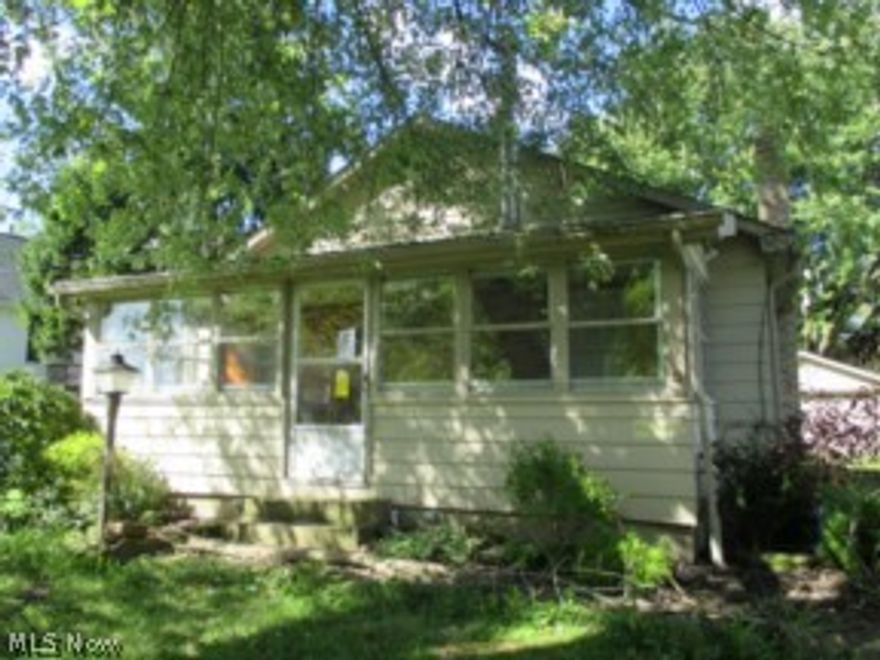 Cozy 3 bedroom ranch located in a rural area.  Dining room features a corner built in cabinet...enclosed front and rear porches.