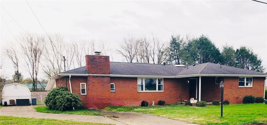 Welcome to 2313 Rockland Ave, Belpre:  A four-bedroom, 1 1/2 bath, brick ranch.  This home features a spacious living room and eat in kitchen, with sliding doors to the back yard.  Bedrooms are situated around a rectangular hallway and have nice-size closets.  Primary bedroom has a half bath.  Full bath of the home features a jacuzzi tub, shower, skylight and plenty of custom storage.  Step down from the kitchen to the family room with a wood burning fireplace and wet bar for hosting family and friends.  There's also a laundry room, two-car garage and an additional outbuilding.  All of this on a nice size, level, fenced yard, with a back deck for additional entertaining space.  Plus, it's conveniently located minutes from shopping and health care.  Imagine yourself living in this home.