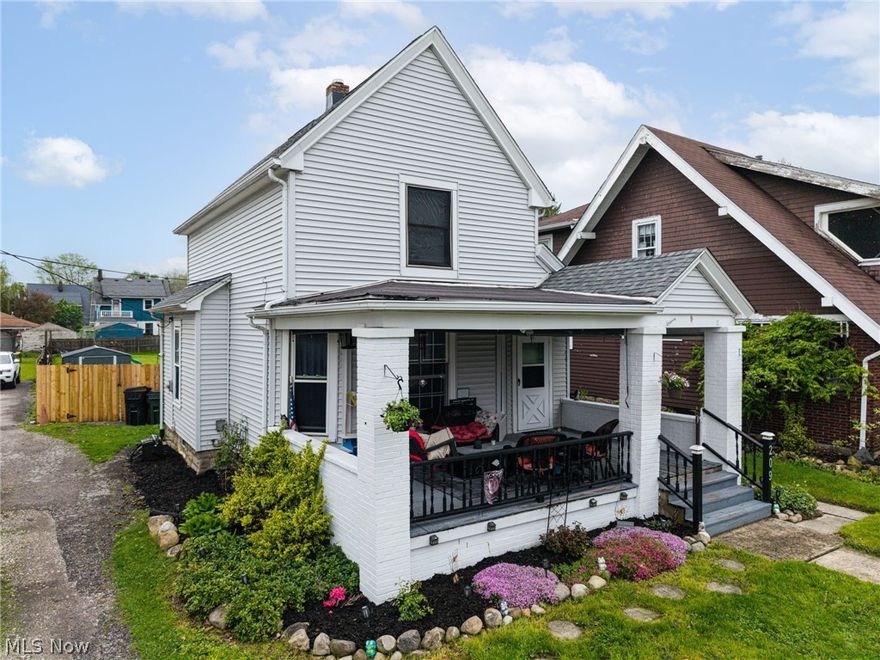 Welcome home to this charming colonial in Elyria, where curb appeal and comfort come together from the moment you arrive. A huge, welcoming front porch sets the tone—perfect for morning coffee or relaxing evenings—overlooking beautifully landscaped grounds filled with established perennials. Step inside to a cozy living room featuring fresh paint and updated flooring that flows seamlessly into the dining area. Just beyond, gorgeous French doors open to a first-floor bedroom, offering flexibility for guests, a home office, or convenient one-floor living. The kitchen is both functional and inviting, complete with all appliances, freshly painted cabinetry, and newer flooring. Upstairs, you’ll find two sizable bedrooms along with a large, fully remodeled full bath boasting newer flooring and modern finishes. The lower level provides a dedicated laundry area along with additional storage space. Out back, the fully privacy-fenced yard creates your own private retreat—perfect for entertaining or unwinding. Enjoy the patio, back deck, fire pit, and a newer shed (2022), all surrounded by lush landscaping. Additional updates include a new roof (2021), sewer line (2021), hot water tank, and some newer windows for added peace of mind. Conveniently located just minutes from restaurants, grocery stores, parks, and easy access to the Ohio Turnpike, this move-in ready home checks all the boxes.