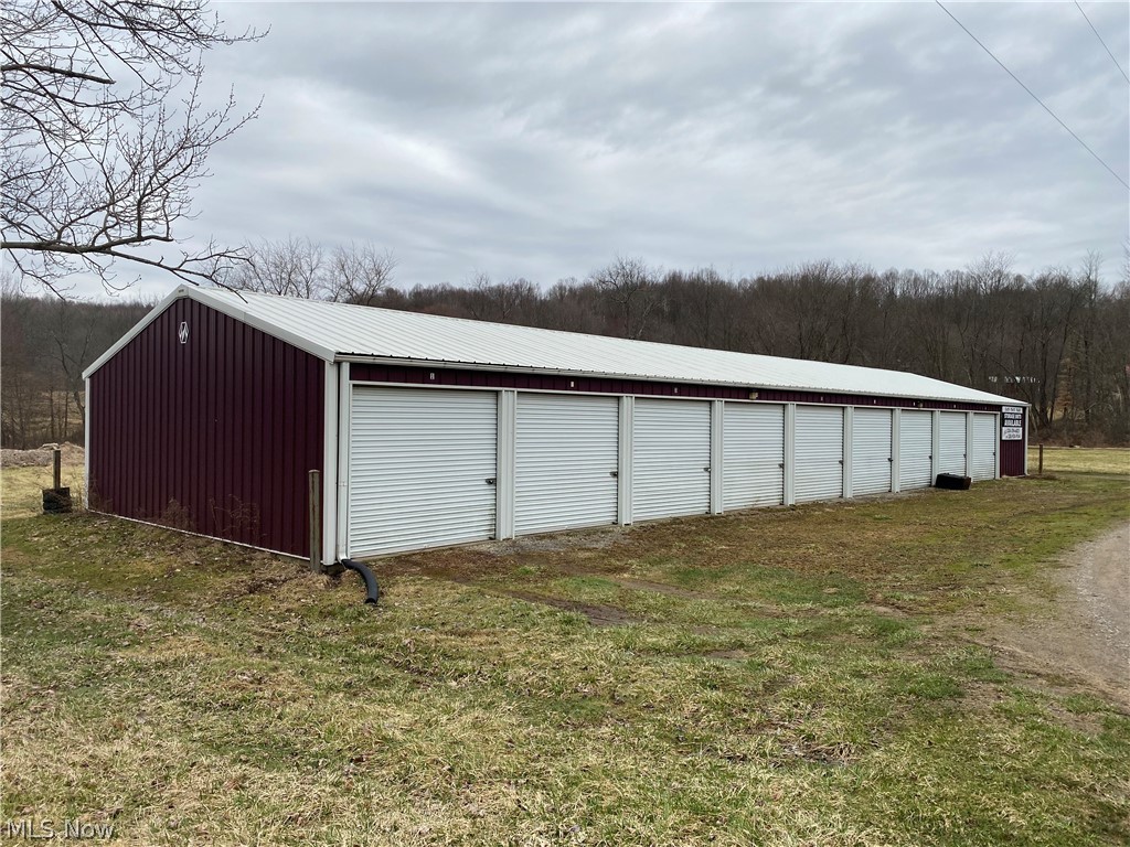 GREAT INVESTMENT PROPERTY: 24 income producing storage units. ( 9 units ) 10x20 rents for $55 / mo, ( 9 units ) 10x10 rents for $45/ mo , ( 6 units ) 5x10 rents for $25/ mo. This commercial property also includes a 28 x 48 pole building with a concrete floor that rents for $500/ mo. This property has a great rental history with rents that could be increased. There is additional space on the 1.72 acres to add more units. This property could also be a great location to collect rent for advertisement signs.