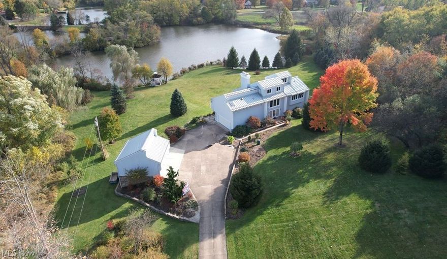 Break away from the busy day & find relaxation when you step into this sleek, modern & contemporary home w/a reverse floor plan. Youll be blown away w/the breathtaking water views on every level. Situated on approx. 5 acres surrounded by impeccable landscaping & mature trees, this home is one-of-a-kind. The foyer greets you & flows into the cozy library w/fabulous built-ins, stone FP w/access to your outdoor oasis w/picturesque views. There is also a remodeled (2022) laundry rm, a new (2022) built-in wine bar cabinetry w/wine chiller & cigar humidor, 2 BDRMS w/a full & half BTH.  Upstairs, the gorgeous lake views continue. Sit in the immaculate great RM w/20 ft vaulted ceiling w/fully tiled gas FP, wood floor & LED lights w/access to a balcony. The kitchen is on the second floor open & equipped w/high lacquer custom Leicht German Cabinetry, new “slate” appliances w/Cambria counters (2017). Your master suite awaits, w/a private balcony, walk-in closet, & a vast bathroom w/heated floor, jetted tub & shower.  The walk-out finished LL has a living RM, Sun RM w/detailed tile floors, w/a BDRM & full BTH. A loft on the 4th floor offers an office space w/a view completing this homes interior. A 2 car attached & 2 car detached garage feat. a LL, for extra storage or for an additnl workshop area! Youll love the private gazebo on the five acre lake (approx 60 ft deep). Addtnl updates include, HWT (2022), Well-rite pressure tank (2022) Metal roof (2016), the list goes on!