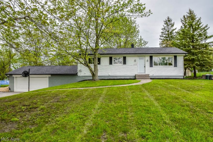 Completely remodeled 3 bedroom, 2.5 bath ranch with a finished lower level! New flooring and fresh paint throughout! Crack open your cookbook in the brand new kitchen with white cabinets, stainless steel appliances and tile backsplash. It opens to the dining room with sliding glass doors to the back patio. Gather in the sun-filled living room with a picture window. Down the hall, the master suite offers 2 closets and an updated full bath with tile shower surround and a new vanity. There are 2 additional bedrooms and a full bath with tile shower surround, new vanity and shiplap walls. Wonderful, finished walkout lower level with a rec room, dry bar with butcher block counters, laundry room, half bath and a bonus/playroom. The lower level walks out to the oversized 31x22 2-car garage with attic storage. Enjoy the huge, super private backyard that is fully fenced with a brand new patio perfect for entertaining! Updates include a brand new roof, AC, gutters and downspouts, new front door,