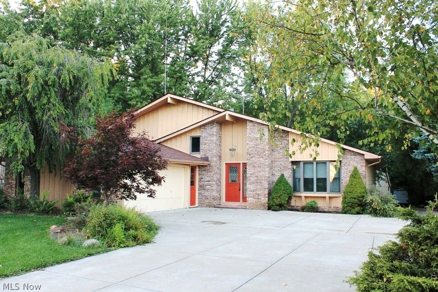 Clean one-owner 4 BR 3 BA w/ large 2-story versatile outbuilding. Private wooded lot backs to around 800 acres of Mill Stream Run Reservation (Cleveland Metroparks.) Meticulously maintained & luxury updated throughout. Beautiful newer solid woodwork, spindled wood stair cases, & Anderson windows w/ custom blinds. Carpet has been recently replaced in all bedrooms and living areas. Square kitchen with newer cabinets and eating area. Finished family room in basement has a wall-to-wall wood burning brick fireplace w/ custom wood mantle and is custom wired for sound. Huge master bedroom w/ closet expansion into attic has a large private glamour bath w/ Jacuzzi tub w/ double door entry. New “green” dual-fuel gas furnace system & a/c. Contractors dream outbuilding w/ water, gas heat, heavy duty electrical, finished 2nd floor, & much more. Commercial thick concrete drive from street to outbuilding in back of lot. 2.5 car attached side load garage. Paver patio overlooking serene treed yard and