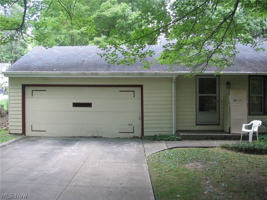 You must see this charming ranch just steps away from Independence High School, Middle School, library, civic center, pool, tennis courts and all amenities that Elmwood Park offers. Set back from street for privacy, the spacious living room looks into wooded front yard and flows into dining room. Enter knotty pine kitchen with access to backyard, finished basement, and a beautiful half bath. 3 bedrooms and full bath are on other side of home. Large master bedroom has 2 closets lined with cedar as are other bedroom closets. Lower level has huge rec room, summer kitchen and laundry area. Home has quiet baseboard hot water heat but also has central AC installed in attic. Attached garage is accessed through what looks like closet to left of front door.