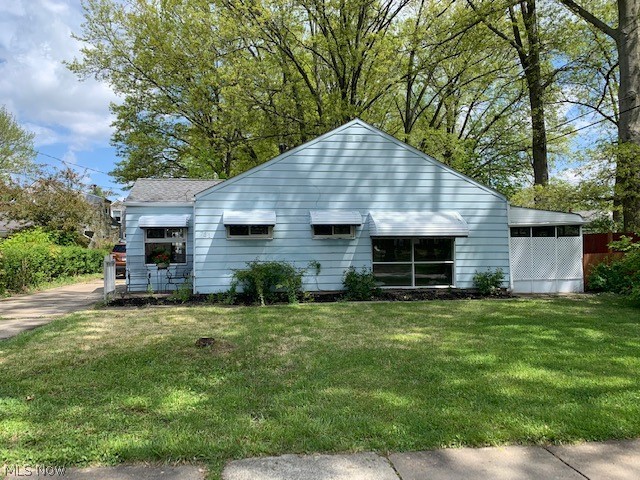 Spacious first floor living! Come enjoy this recently power washed, 3 bedroom home complete with a large fenced in private back yard and enclosed patio room! This adorable home has a cute breakfast nook next to a bright window off the kitchen, a mammoth living room, a first floor laundry, and 3 nicely sized bedrooms! The bathroom was remodeled recently and is ready for someone to come make the next rounds of updates. Enjoy some coffee in the morning or watch some TV in the evenings in the screened in patio room! The yard is completely fenced in for your fur baby safety! A spacious detached garage is one extra perk for this home. Did I mention that a wonderful bonus is that this house is across from Lions Park? This price is just right for a first time home buyer, or someone ready to downsize! Come visit it today!!