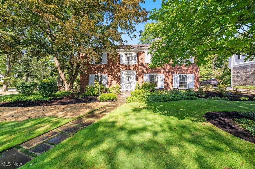 Opportunity knocks! Boasting over 3,500 square feet and set on a peaceful .47 acre lot in the heart of Shaker Heights’ Mercer neighborhood, this classic red brick 4 bedroom, 3.5 bath center-hall Colonial Revival with a 2 car attached garage blends timeless architectural details with a functional floor plan.  Inside, the layout is balanced and light-filled with large-scale windows and hardwood floors throughout. The spacious entry hall opens to both formal and casual living spaces, including an oversized living room with fireplace, formal dining and a richly paneled office/study; ideal for today’s work-from-home lifestyle and or toddler playroom. The spacious kitchen and breakfast area offers generous natural light and endless renovation potential. An airy family room with wet bar and fireplace brings the outdoors in with its wall of windows and direct indoor-outdoor flow to the patio and a deep private backyard. Upstairs you’ll find four well-appointed bedrooms, each with direct access to a full bath—a rare and desirable feature. The second floor also offers multiple closets, including a cedar closet, providing ample storage and functionality. The basement offers large rooms that can serve as storage and hobby/recreation space with future finishing potential. Ready for your modern reimagining, this piece of Shaker Heights’ architectural heritage offers the space, character, and location to create your dream home!  Call today for your private viewing. Do not let this opportunity slip by!