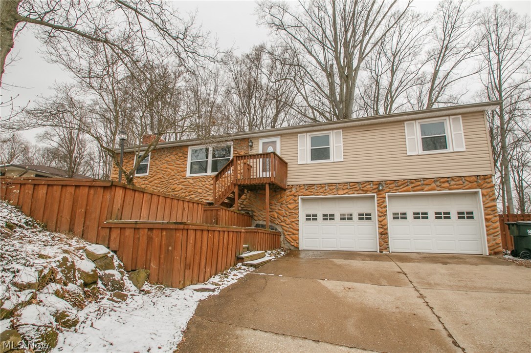 Enjoy this spacious 3 bedroom 1.5 bath raised ranch on a large, fenced lot. Many updates have been done to this home including: fresh paint, hardwood laminate flooring, lighting fixtures, newer roof, siding, windows, high efficiency furnace and both bathrooms. The family room has been updated with a white-washed fireplace and newer carpet. The lower level offers a finished rec room, laundry area and storage. Call for your private showing today.