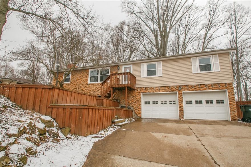 Enjoy this spacious 3 bedroom 1.5 bath raised ranch on a large, fenced lot. Many updates have been done to this home including: fresh paint, hardwood laminate flooring, lighting fixtures, newer roof, siding, windows, high efficiency furnace and both bathrooms. The family room has been updated with a white-washed fireplace and newer carpet. The lower level offers a finished rec room, laundry area and storage. Call for your private showing today.