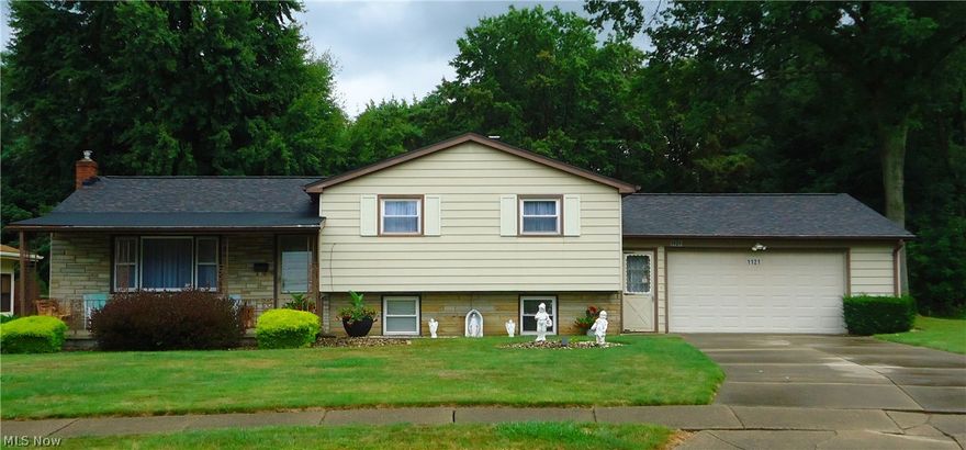 This remarkable 3 bedroom home has multiple levels of large space for entertaining. Pristine hardwood floors in the bedrooms, with new carpet and flooring throughout the other living spaces. Brand new roof. Multi-level home features 2nd kitchen area, rec room with walk out to garage, plus a finished basement with 2nd full bath. Main bedroom features a door to a wooden deck and a beautiful back yard scene. Exterior features include a large covered front porch, rear deck off of kitchen and concrete patio. Also an exterior brick fireplace, large shed for yard equipment and smaller shed off garage. Don't let this one get away from you!