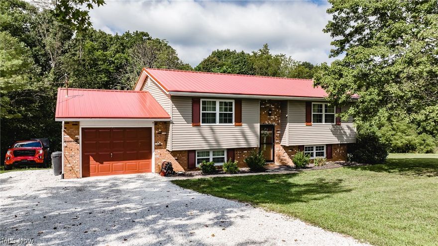 Enjoy country serenity in this home situated on approximately one acre. Meticulously maintained and looking for a new owner to make it shine again! Upgrades include metal roof, replacement windows, vinyl siding and newer water heater and HVAC. First floor offers spacious eat-in kitchen; all appliances remain; living room with 2 bedrooms and walk through full bath. The lower level offers a family room, 1 spacious bedroom, full bath, and unfinished area  with laundry.  Storage area under the 17 X 10 deck which is off the eat-in-kitchen.  This is definitely not a drive-by, must see to appreciate!!!!