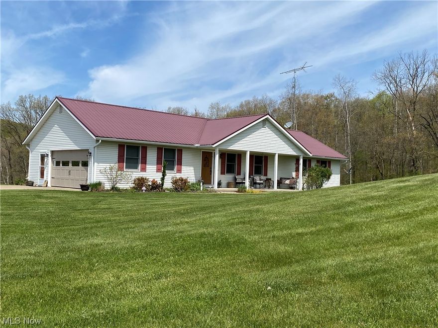 A Country Estate that must be seen to appreciate!  Two homes, two septics, one well, six acres, too Perfect!  Beautifully landscaped six acres with spacious Ranch home with three bedrooms, whole house vacuum system with automatic dustpan, 2.5 bathrooms, full laundry room and 2.5 car attached garage all on the Main level.  Attic has SolarTEC tech shield installed for energy savings.  A full basement below that is currently set up as Family Room, 4th bedroom, Hot tub area, storage and utility area with a Walkout to yet another patio area.  From sunrises to sunsets this Atwood Lake Region home has it all!  LOOK OUT BELOW.......and you will find an oversized 40x80  4.5 car garage with two sources of heat, a large air compressor with three additional ports, xtra large Oil Pit, two pull down stairwells for storage above with a push button attic lift elevator to help with lifting those bulky loads you want to store!  Plenty of room for Parking those larger items like boats and RVs on your own