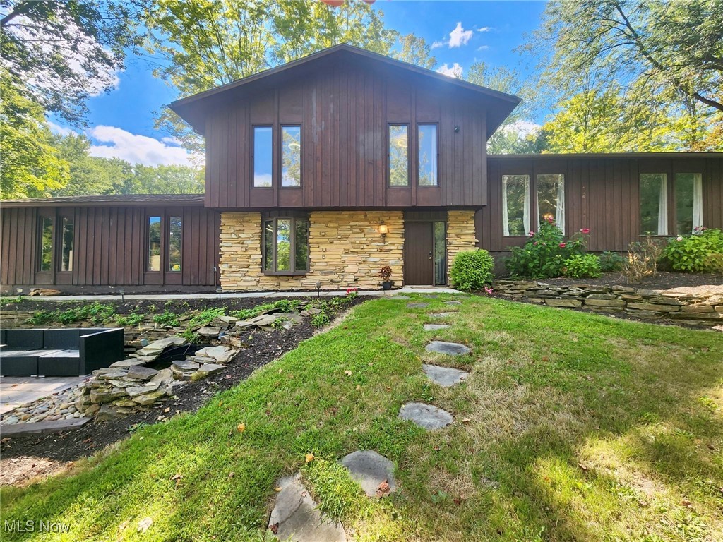 Welcome to your dream lake house in the highly sought-after Beechwood Island Estates of Twin Lakes. This expansive 4-bedroom, 3-bath home offers over 3,400 sq ft of living space with the perfect blend of charm, comfort, and lifestyle. Soaring windows frame stunning views of the canal and adjacent nature preserve, while just across the street you can drop in a kayak and explore the serene lakes at your doorstep. Inside, you’ll find an inviting eat-in kitchen, three spacious living rooms, and a formal dining room—ideal for hosting family and friends. A large stamped concrete patio, updated deck, and multiple gathering areas make entertaining effortless both indoors and out. Upstairs are three generous bedrooms, including an oversized master suite with two walk-in closets. On the main floor, a private in-law suite with kitchenette, accessible shower, bedroom, and living area provides comfort and flexibility for guests or multigenerational living. Beechwood Island Estates is more than a neighborhood—it’s a lifestyle. Residents enjoy private lake and canal access, summer lifeguards, and community events such as kids’ fishing derbies, outdoor movie nights, and happy hours for adults. Backing up to a peaceful nature preserve, this home delivers privacy, natural beauty, and year-round enjoyment of the outdoors. Don’t miss this rare opportunity to own in one of the area’s most desirable waterfront communities.